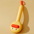 Small yellow duck-shaped pet grooming comb with needle pins for cats and dogs