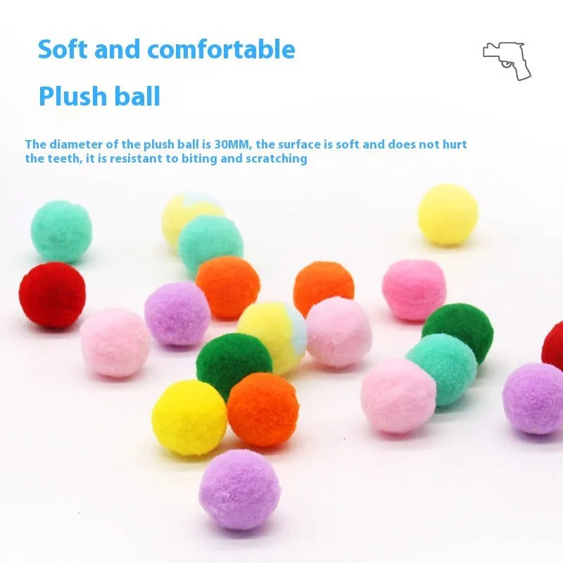 Pet toy launch gun with a selection of soft red plush balls for interactive dog and cat fetch games.