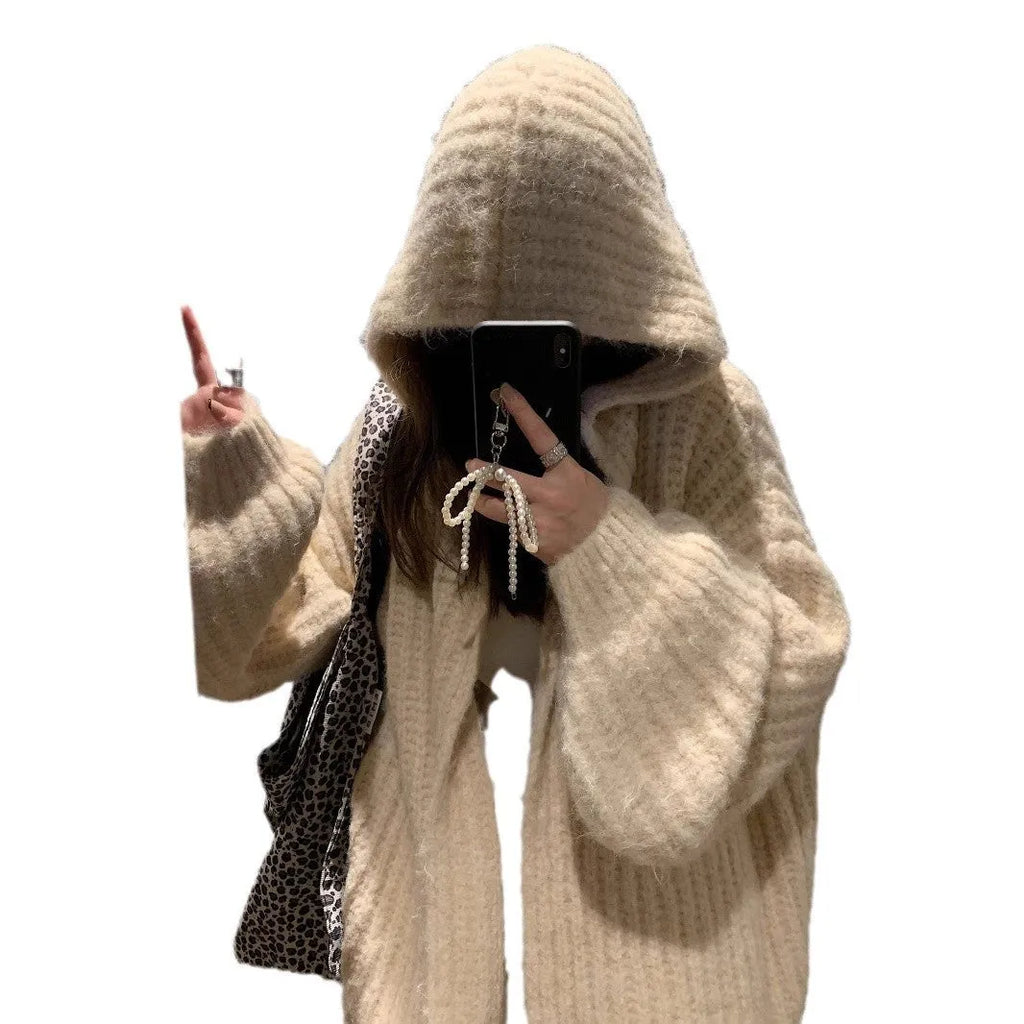 Brown women's hooded sweater cardigan with thick knit and loose fit on a hanger.