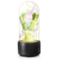 LED bouquet night light with Bluetooth speaker inside a glass cover on a black base.