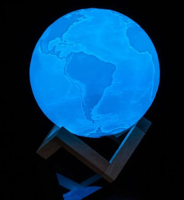 3D printed spherical moon lamp showing lunar surface texture on wooden holder