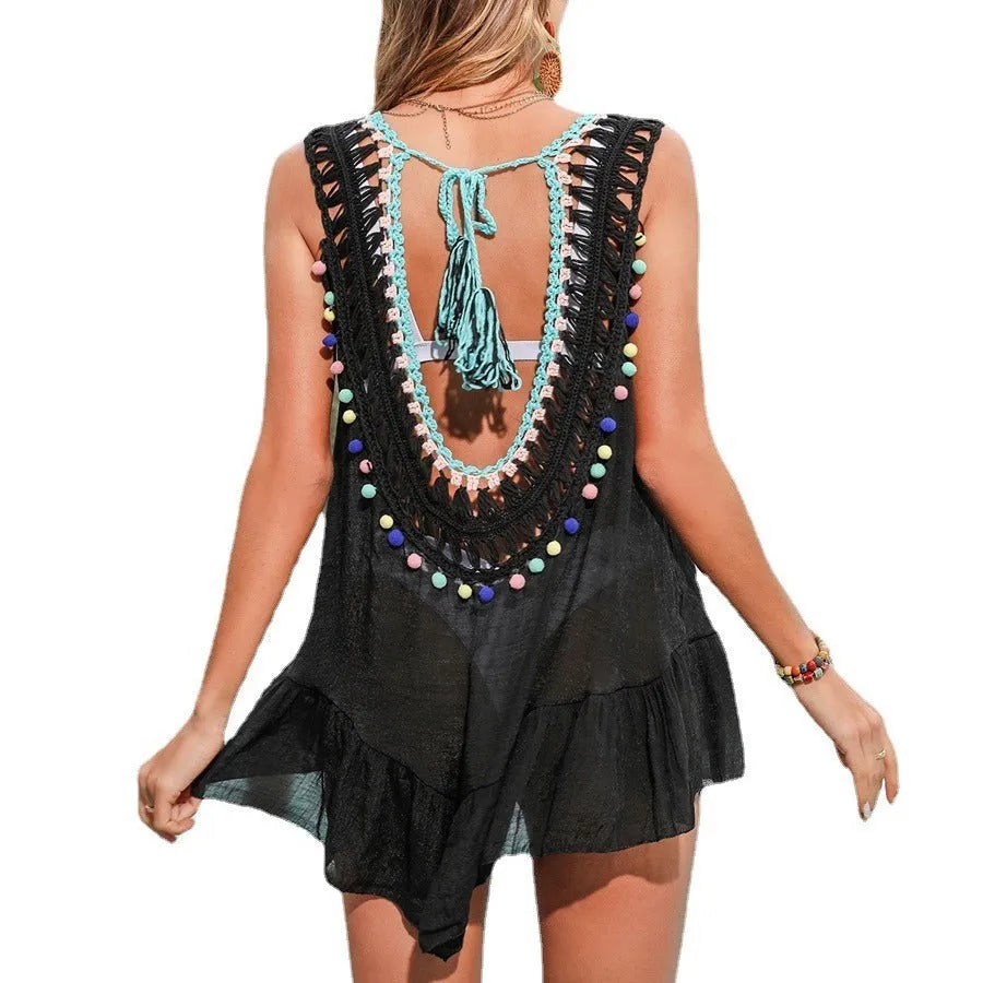 Black women's beach cover-up with cut-out design and ruffled hem for swimming activities