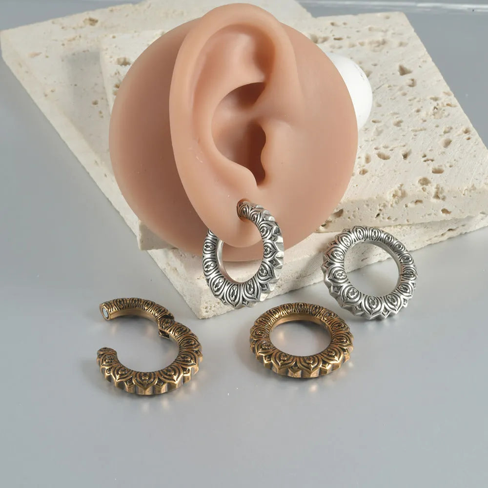 Large geometric dragon-shaped earrings in antique silver stainless steel alloy.