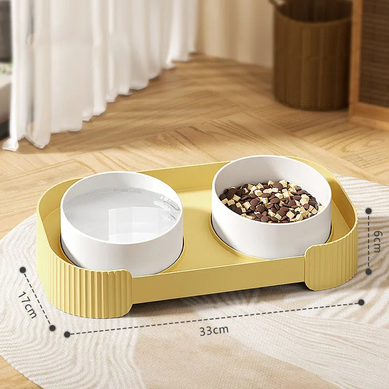 Green ceramic raised cat bowl set with two tilted bowls on non-slip base