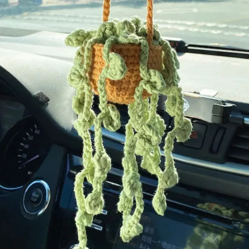 Green and white knitted wool car plant decoration with 8cm base and hanging rope.