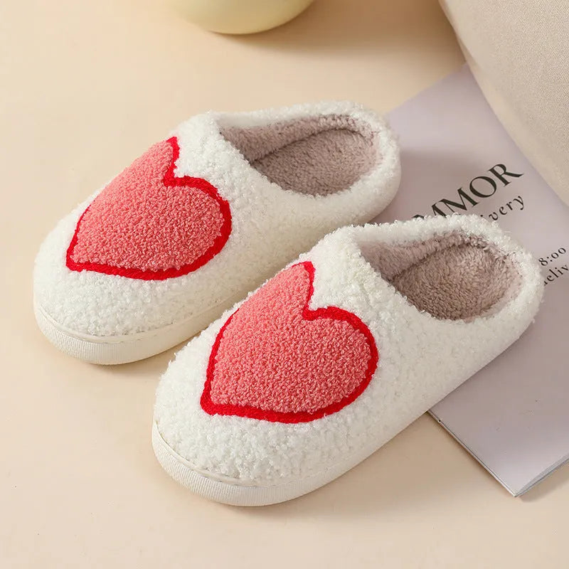 Womens plush cartoon slippers with a round toe and non-slip PVC sole in various colour designs.