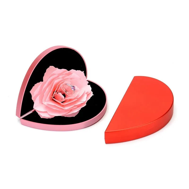 Red heart-shaped rotating plastic ring box for jewellery presentation