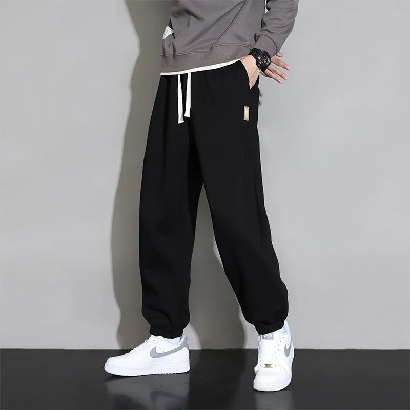Men's loose fit casual sports trousers in gray, black, or army green with drawstring waist