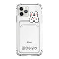 Transparent cartoon card holder phone case for Apple iPhone on a table.