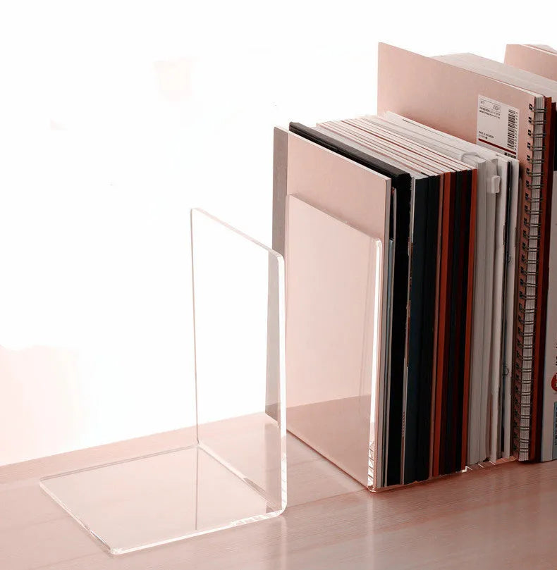 Transparent acrylic bookshelf displaying books on desk with smooth polished edges