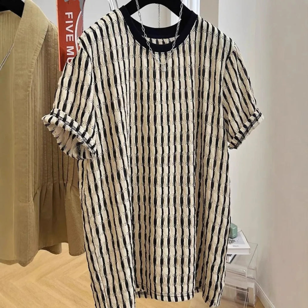 Black and white striped men's loose fit short sleeve pullover shirt made from linen silk blend fabric.