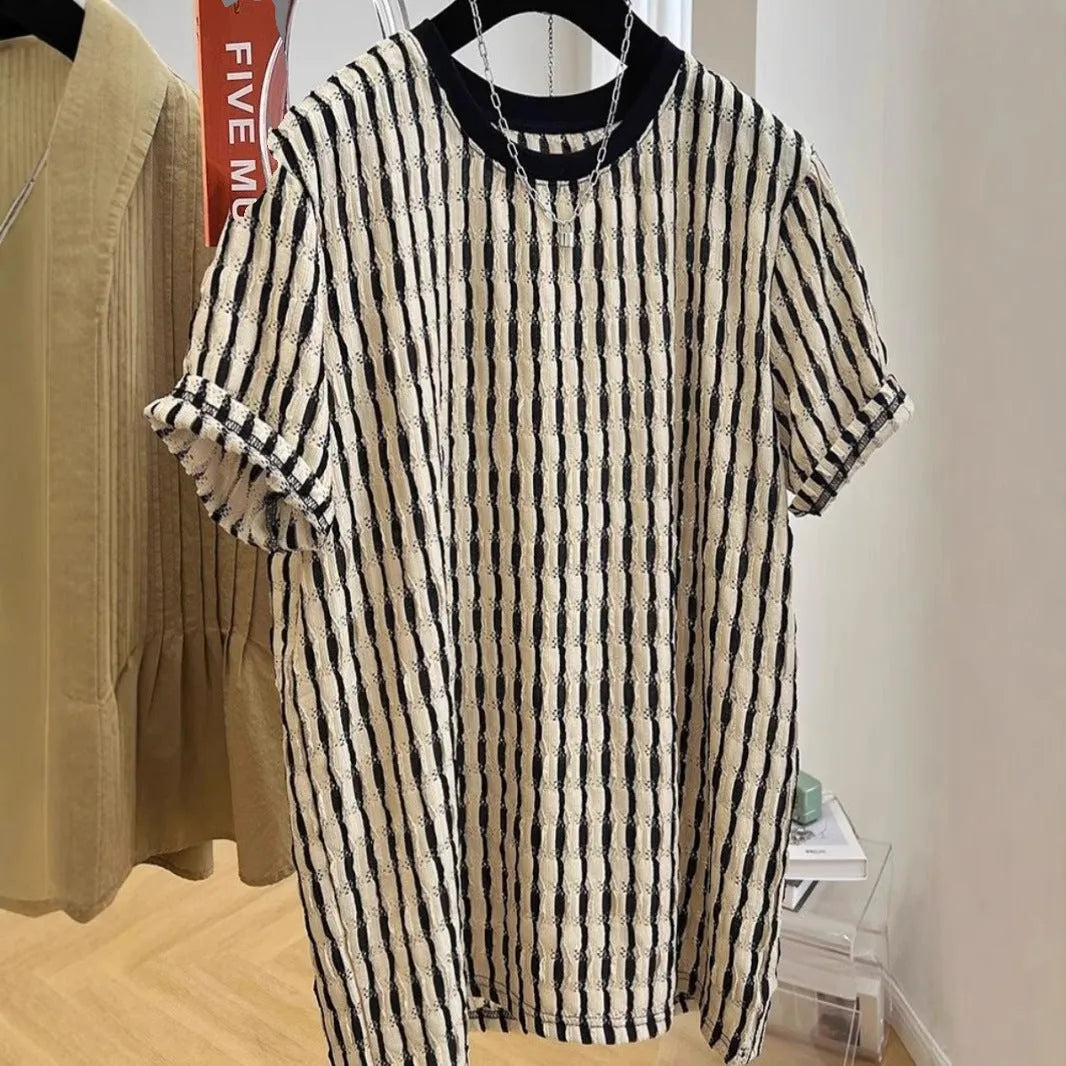 Black and white striped men's loose fit short sleeve pullover shirt made from linen silk blend fabric.