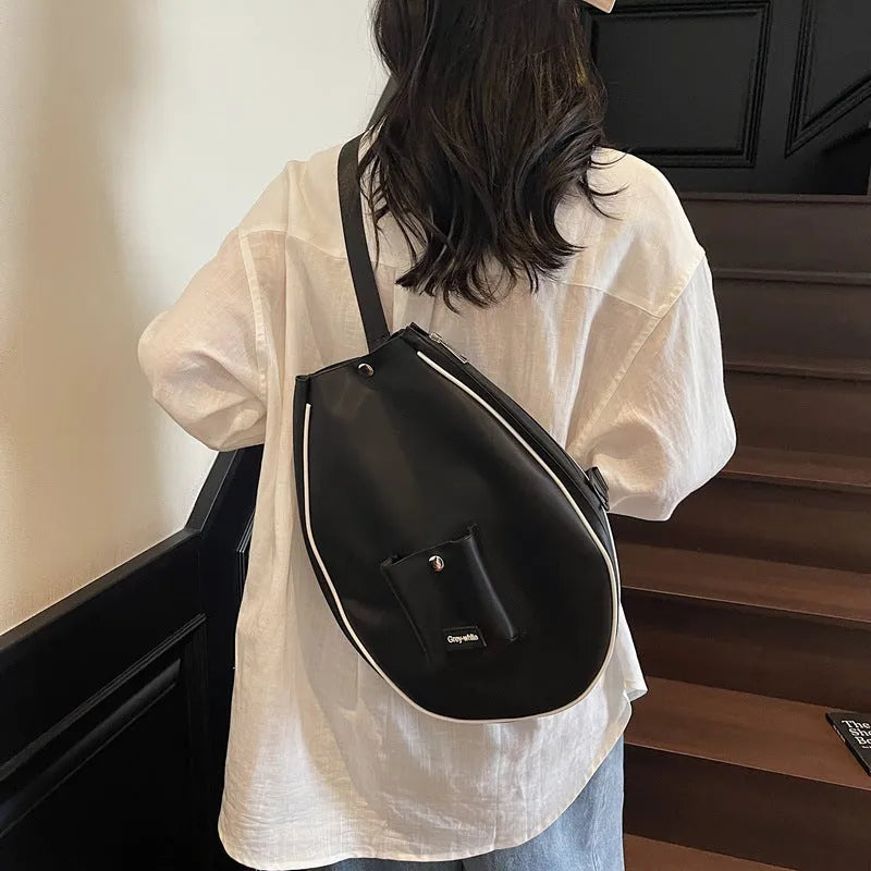 Large black one-shoulder yoga storage bag with a breathable lining and 36-55 litre capacity