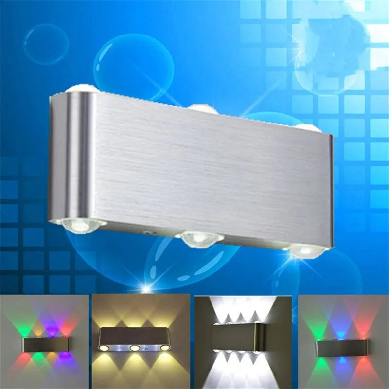 Silver aluminium rectangular LED wall lamp mounted on a wall displaying multiple colour options