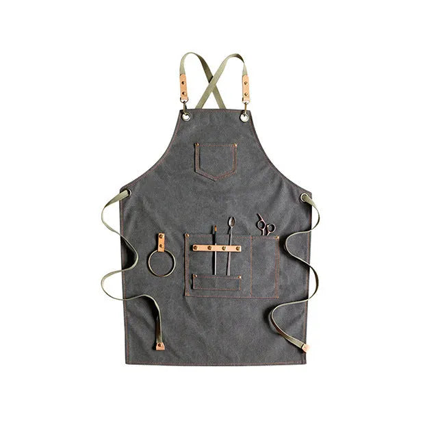 Canvas apron with cross-strap design in camel colour for café work and baking