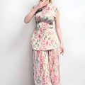 Long sleeve printed chiffon dress set showing separate high-waisted skirt and top.