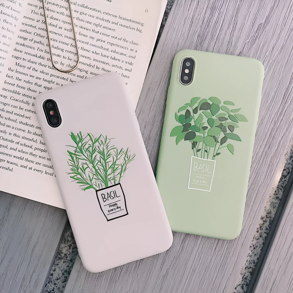 White silicone iPhone case with a detailed green plant pattern on the back, showing full device coverage.