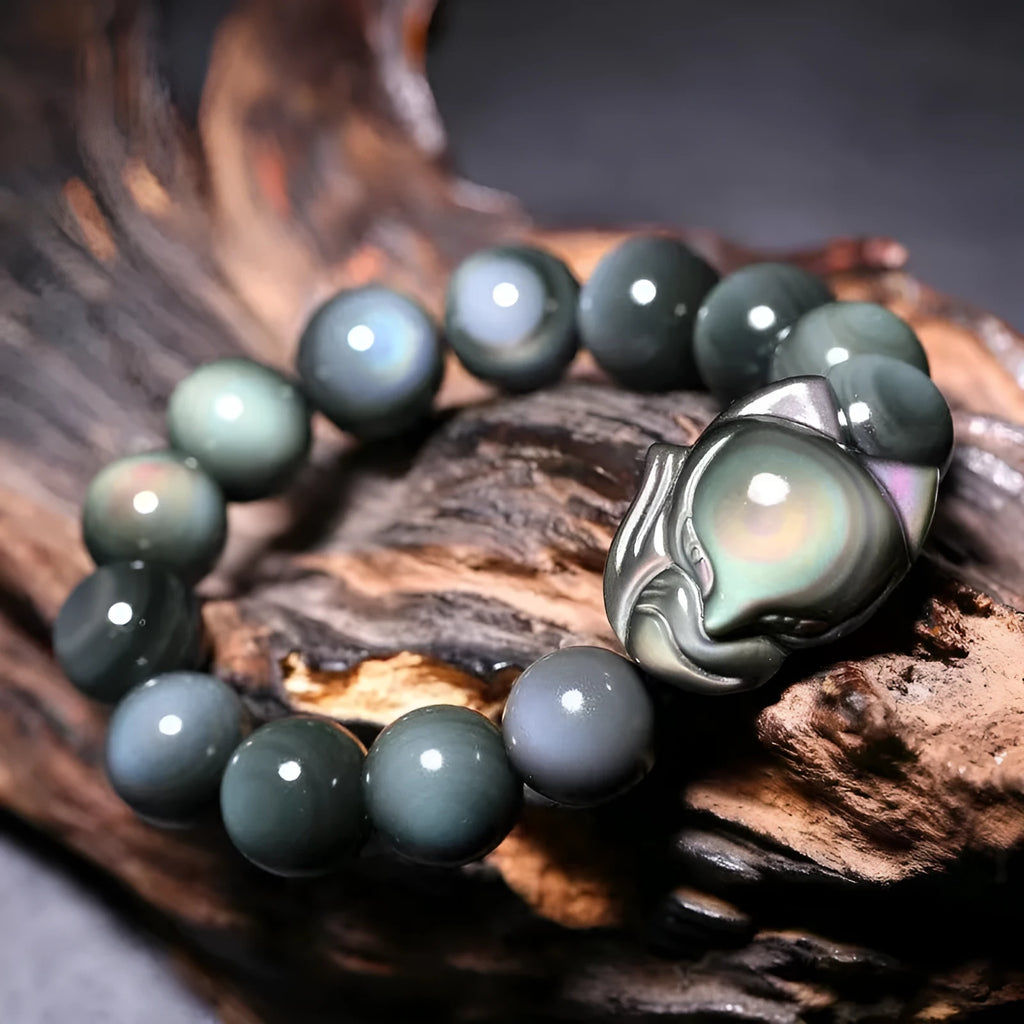 Obsidian stone bracelet with carved fox design, showing 10mm, 12mm, 14mm and 16mm bead size options