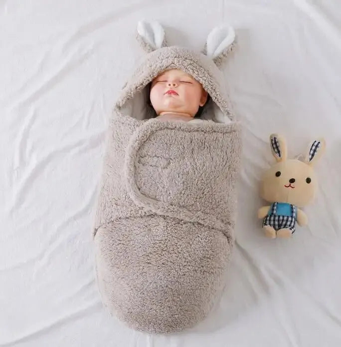 Fluffy fleece baby sleeping bag swaddle in blue with adjustable hook-and-loop closure for newborn