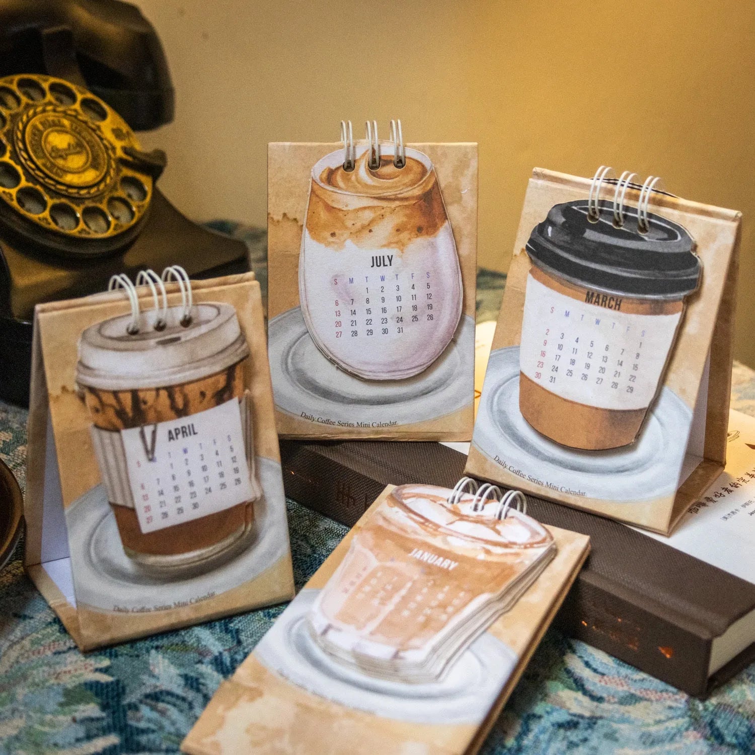 2025 mini desk calendar set showing four different paper calendar designs including Coffee Time theme
