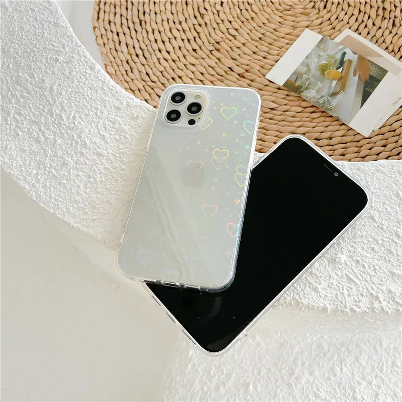Transparent silicone iPhone case with laser love design, shown on a phone.
