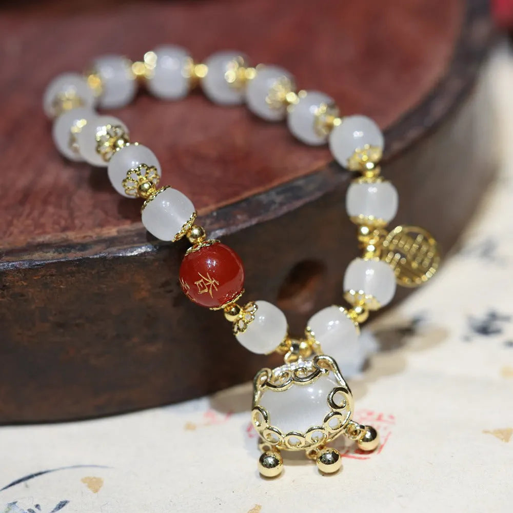 Chinese style glass bracelet with safety lock, windmill and bamboo charms for women