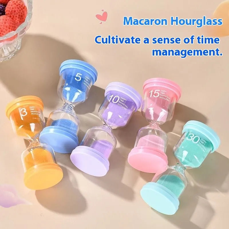 Handmade glass sand timer hourglass in blue colour showing sand flow for timing.