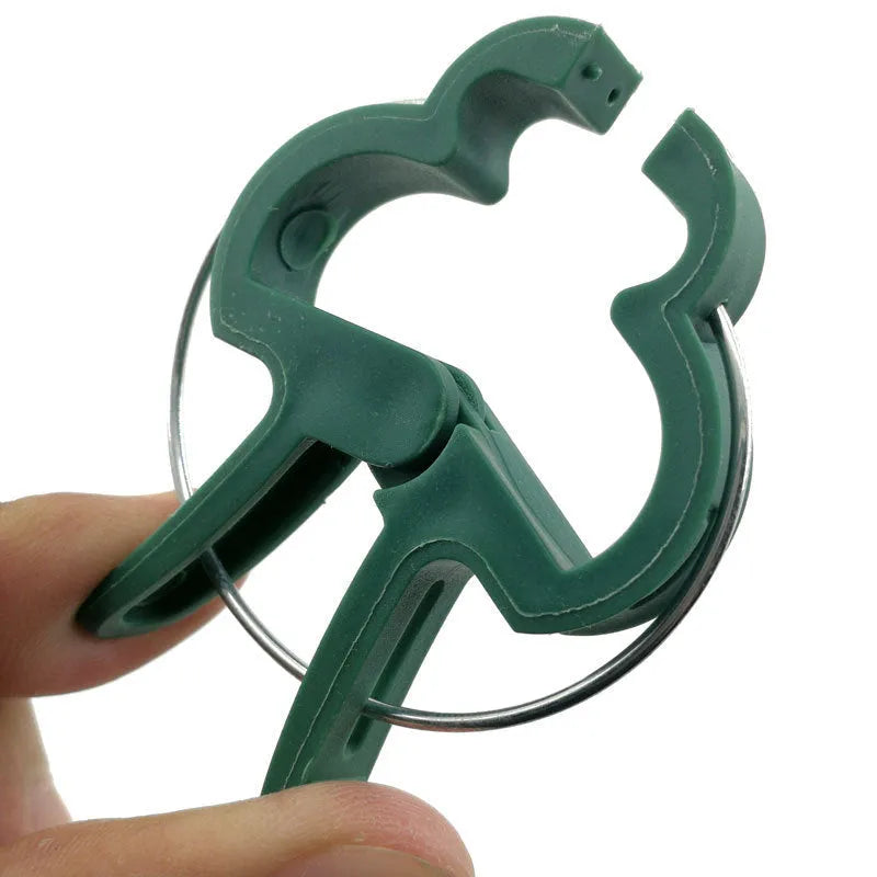 Green plastic and zinc plant fixing clips set with large and small sizes for climbing garden plants