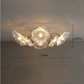 Modern creative ceiling lamp with cluster of white or purple flower shades emitting warm light.
