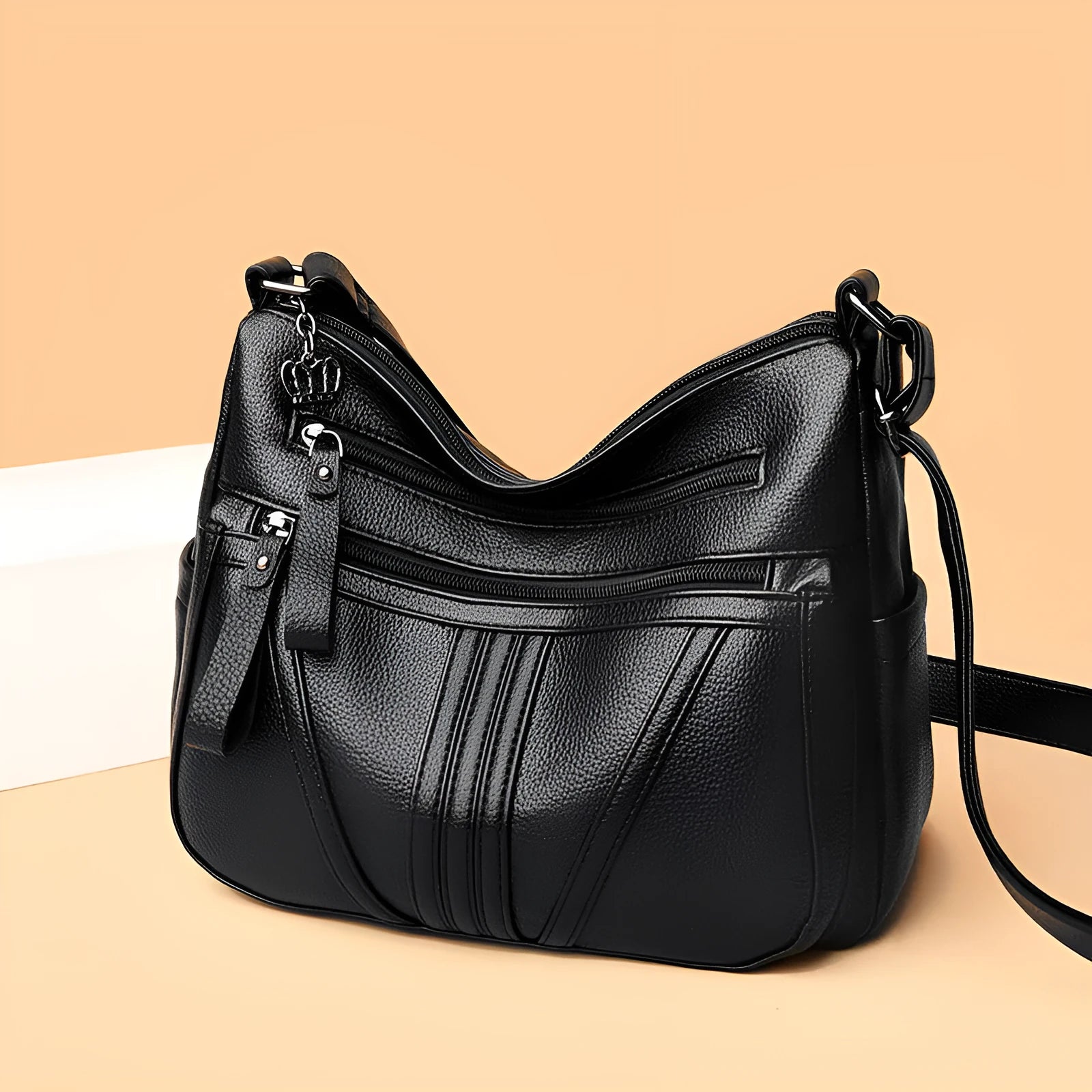 Genuine leather shoulder messenger bag in horizontal square shape with multiple internal compartments and single strap