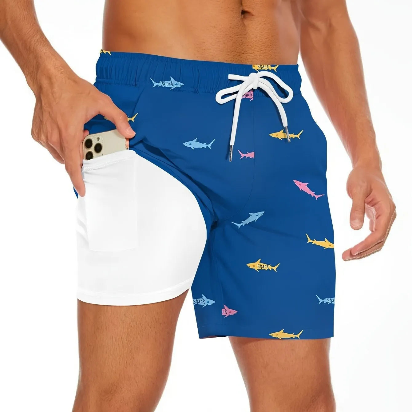 Men's black shark figure beach shorts with drawstring waist, laid flat showing straight leg cut.