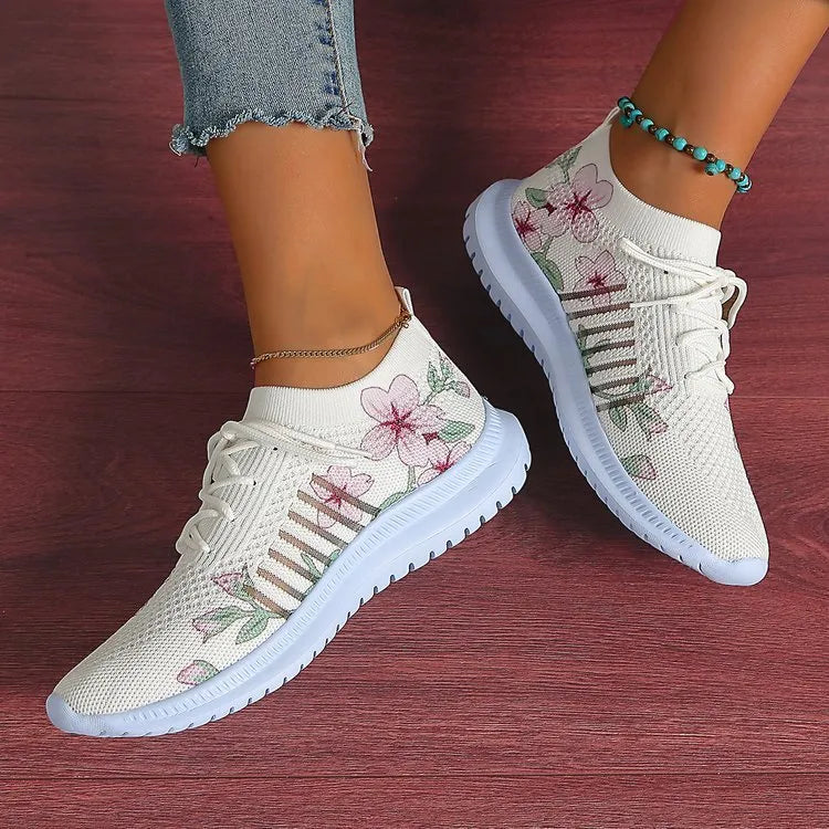 Milky white women's casual running shoes with mesh flyknit upper and rubber sole.