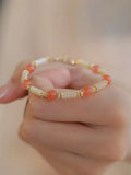 Women's Hetian jade bracelet with bamboo joint design in jade green and red colour options.