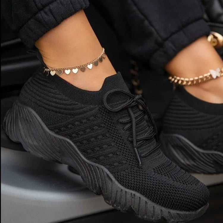 Women's thick-soled solid colour dad sneaker in multiple colour options on a white background.