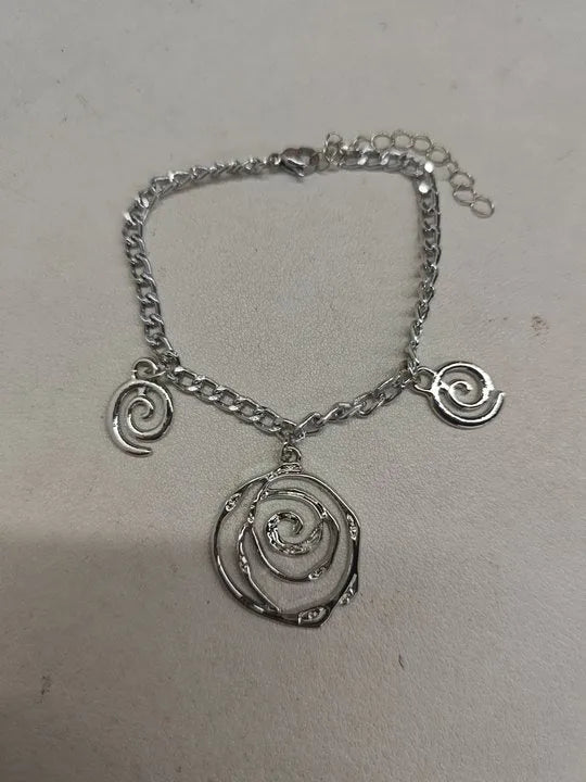 Spiral donut alloy jewellery set with necklace, bracelet, and earrings in gold or silver electroplated finish