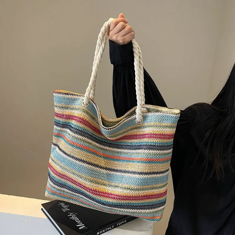 Blue straw and nylon woven large shoulder bag with polyester lining.