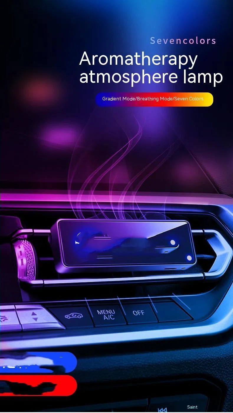 Black car air vent perfume diffuser with LED light attached to dashboard vent