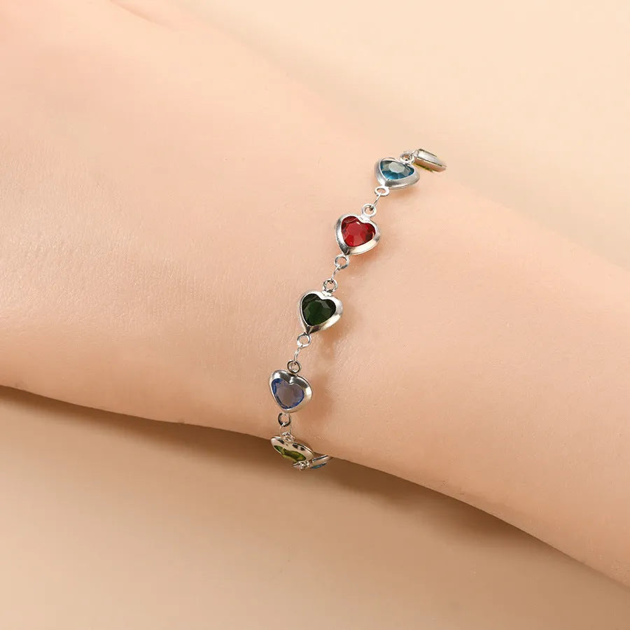 Geometry heart bracelet with devil's eye design in stainless steel showing six colour options