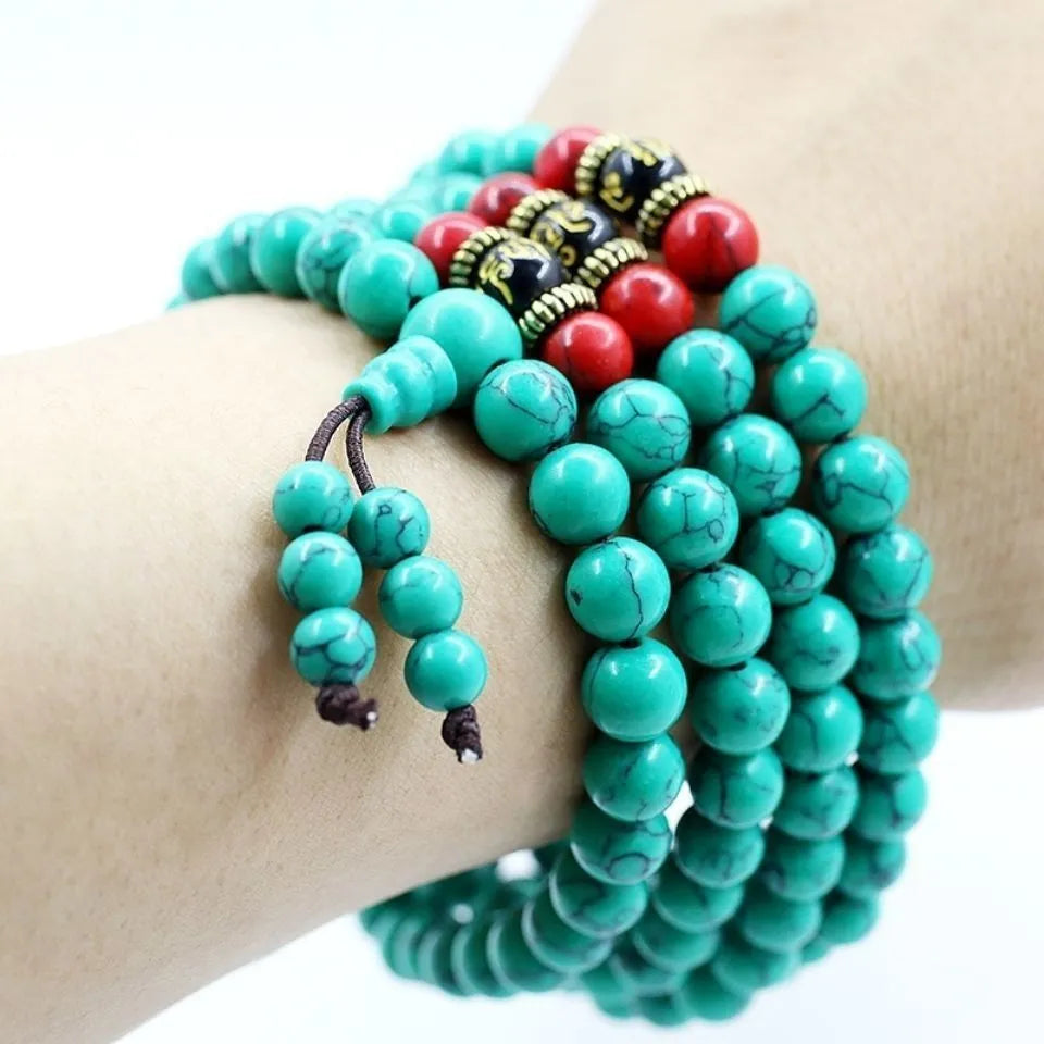Turquoise 108-bead mala bracelet with polished round synthetic stone powder beads.