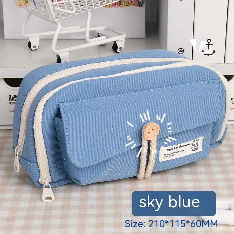 Large capacity canvas pencil case for girls in beige, blue, gray, or green, holding many pens.