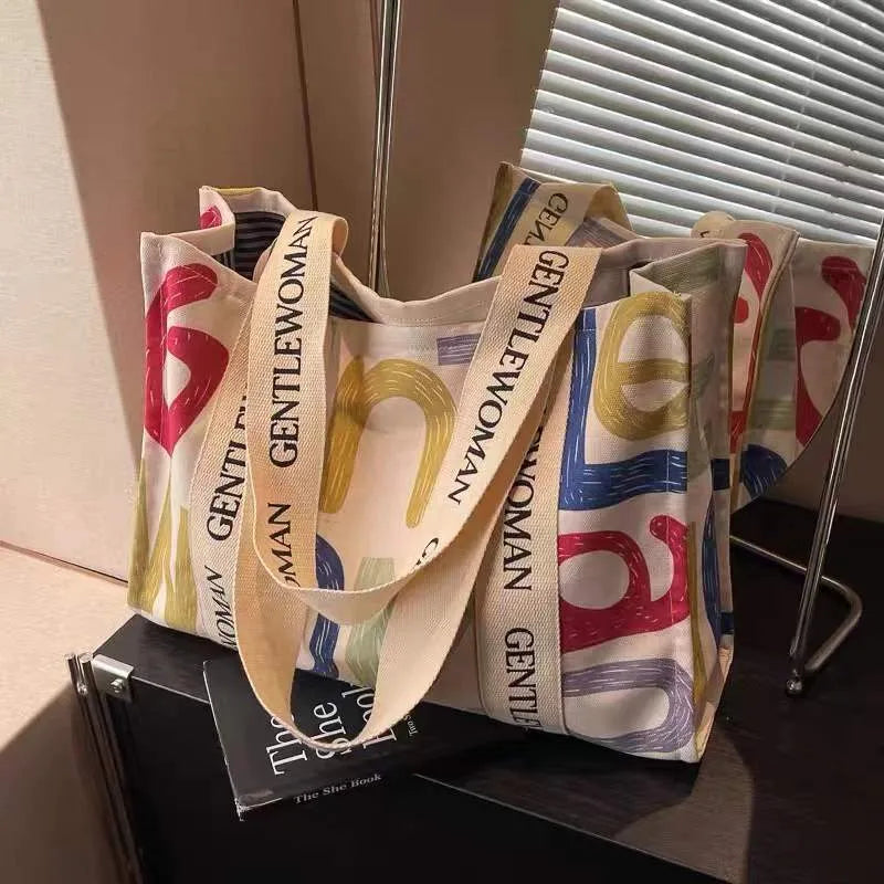 Canvas shoulder tote bag with printed design, large capacity for shopping and travel