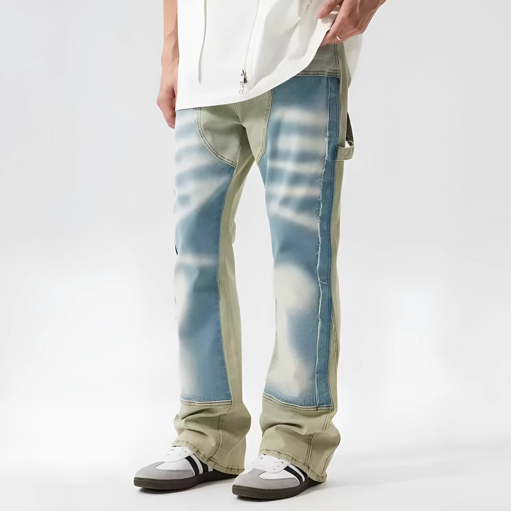 Yellow and blue retro patchwork jeans with splash-ink damaged design and zip fly.