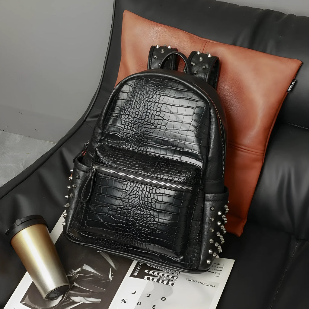 Black waterproof fashion computer bag with oil wax leather finish and rivet detailing showing interior compartments
