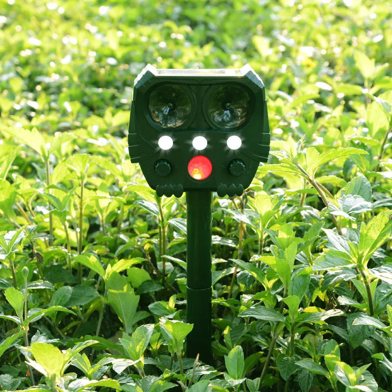 Green solar-powered ultrasonic dog and pest repeller with weatherproof ABS housing