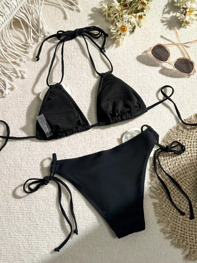 Black women's bikini set with 3D flower patterns, drawstring waist, and backless briefs design