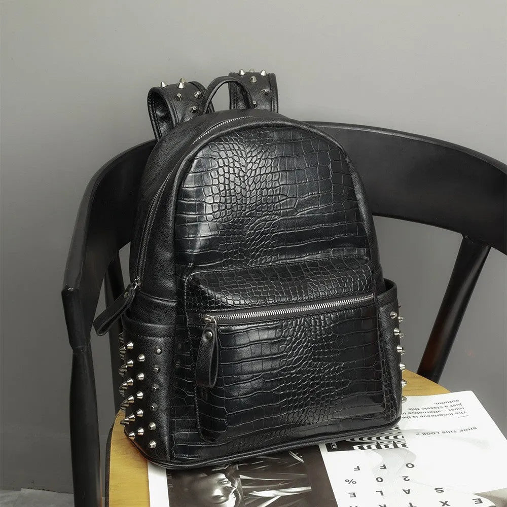 Black waterproof fashion computer bag with oil wax leather finish and rivet detailing showing interior compartments