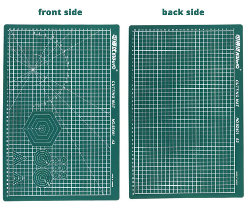 Green A3 self-healing cutting mat with centimetre grid for craft knives on a desk
