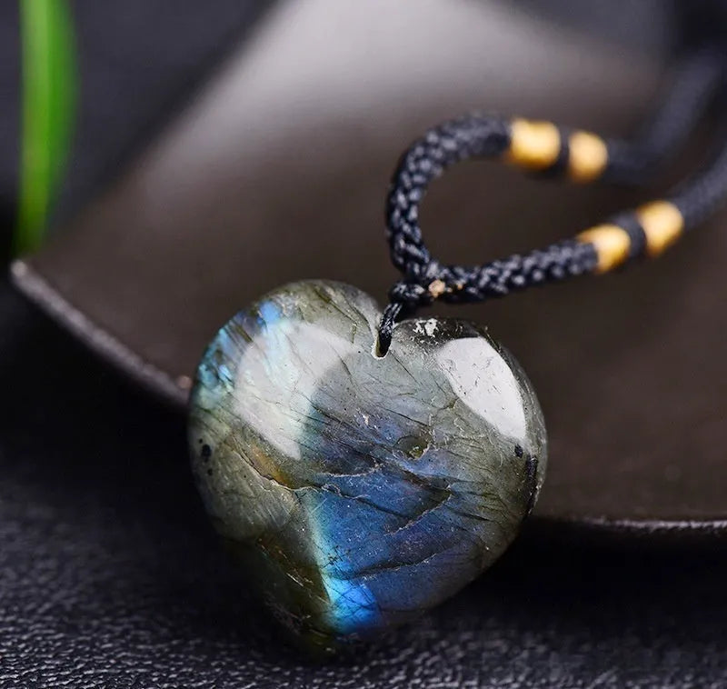 Blue natural Labradorite and Moonstone geometric heart of the ocean pendant necklace on a chain.