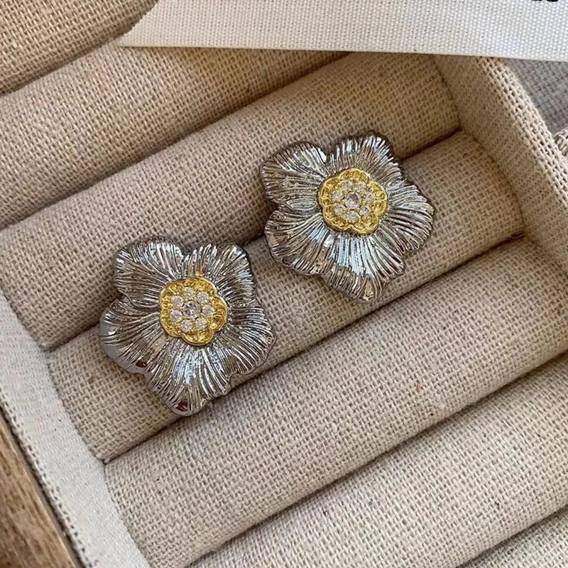 Retro copper stud earrings with textured gardenia floral design and two-tone electroplated finish