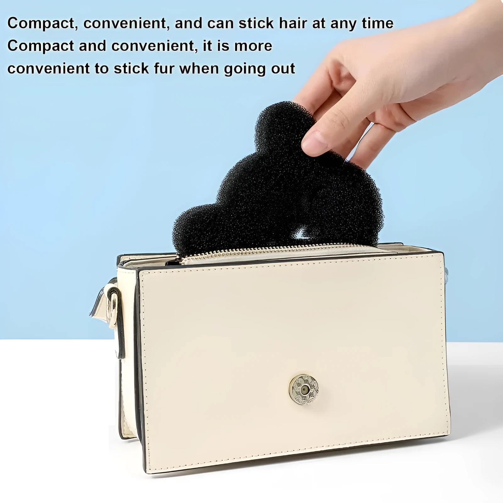 Two black bear-shaped sponge cleaning balls for pet hair removal in laundry